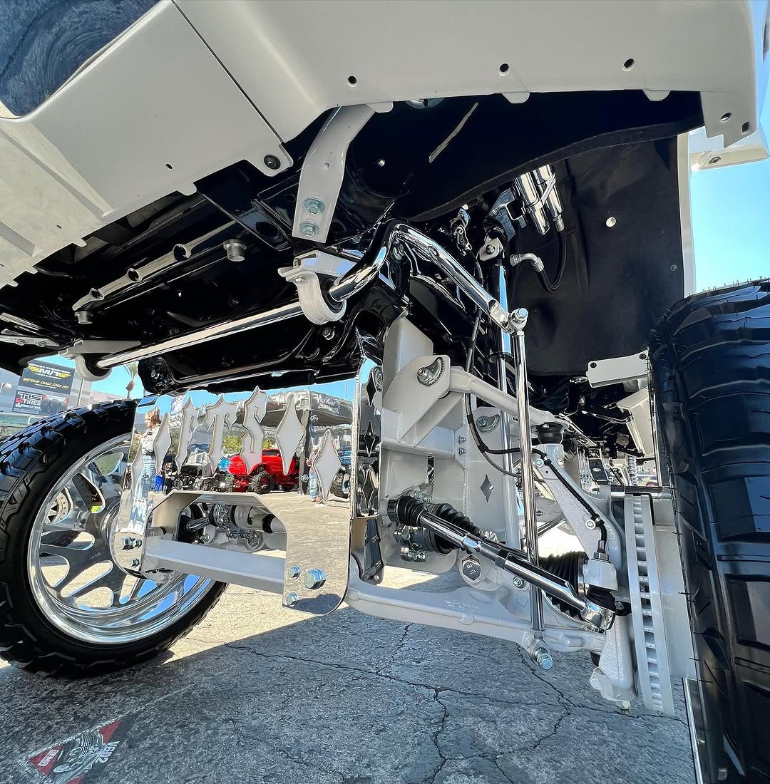 Custom built lifted GMC Denali at trade show with full color match